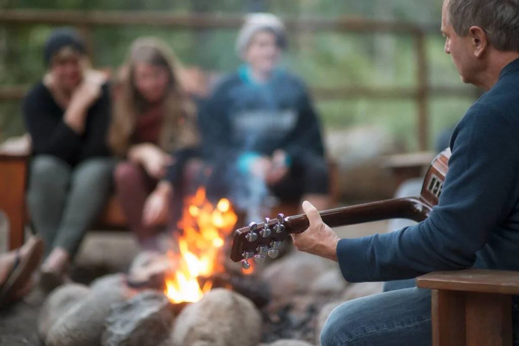 Asset Name: 27324 Credit: Destination BC/Michael Bednar Location: Nahatlatch Provincial Park Popular Area: Cariboo & Gold Rush Trail Region: Vancouver, Coast & Mountains Season: Summer Things to do: Theatre & Performing Arts, Parks & Wilderness Areas Description: A group sitting around the campfire and listening to music in Nahatlatch Provincial Par